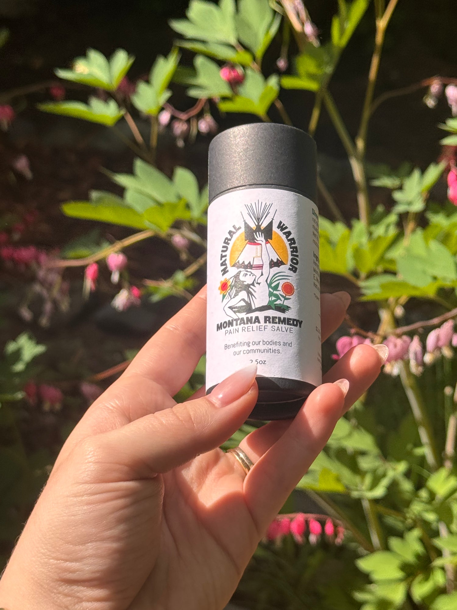 Close-up of Montana Remedy herbal salve stick, portable balm for targeted muscle and joint relief