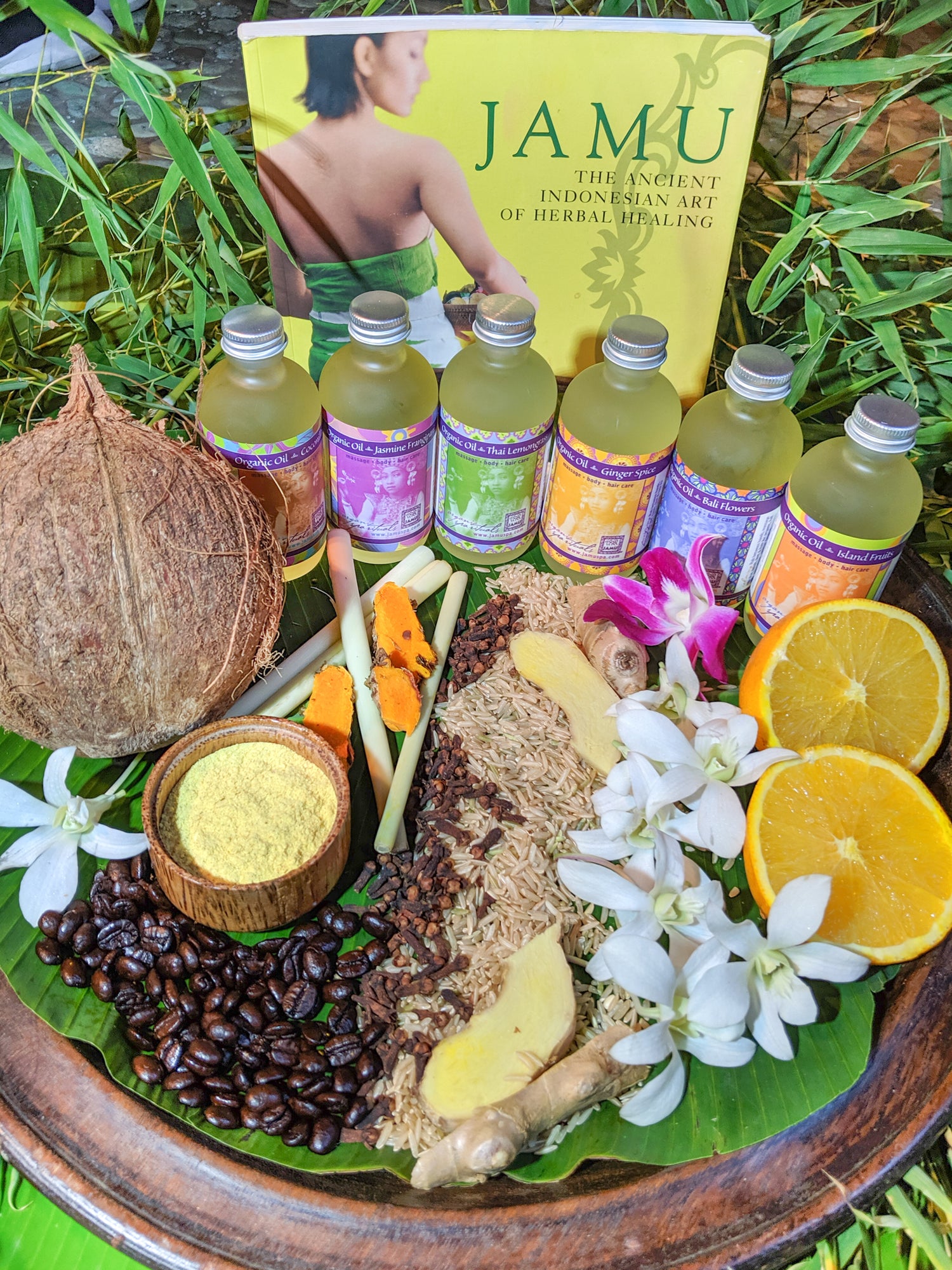 Jamu book, tray of jamu products, spices, flowers