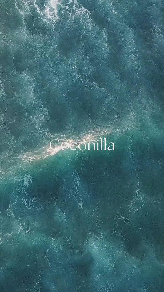 Coconilla organic body oil fragrance notes video highlighting creamy coconut and soft vanilla aromatics